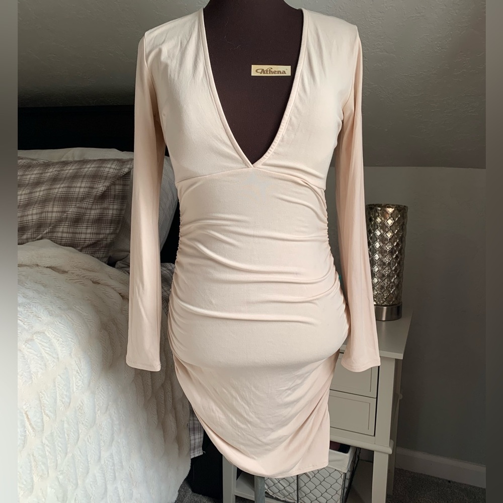 Keshia bodycon deep V dress with ruching in all the right spots!